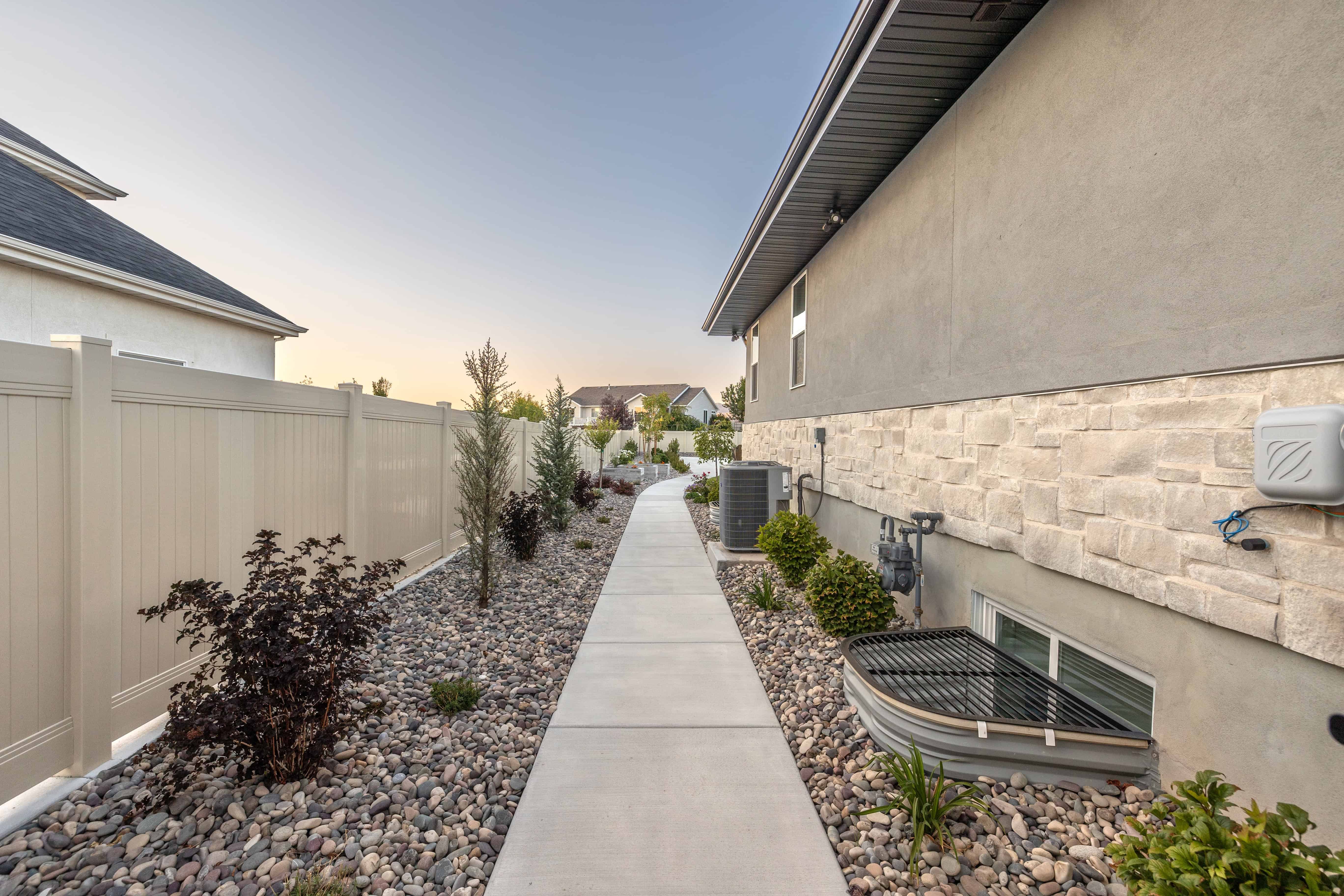Concrete Walkway with Gravel and Plant Surround in Lehi, Utah
