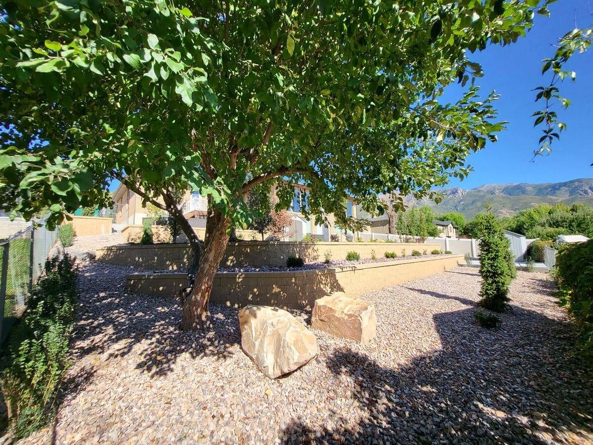 Sustainable landscaping with a custom retaining wall in Sandy, Salt Lake City.