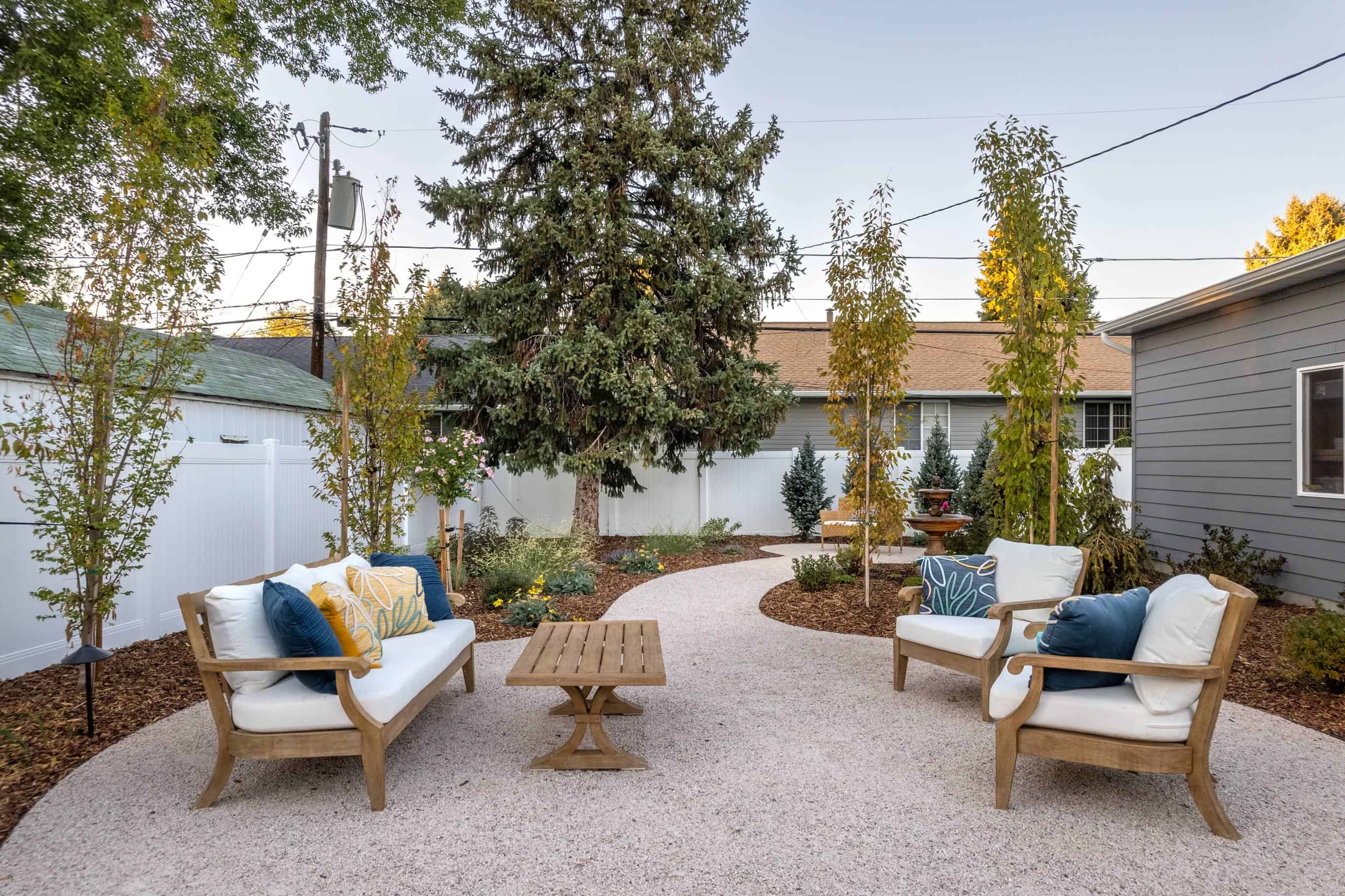 Landscape design with vibrant greenery and modern stone features