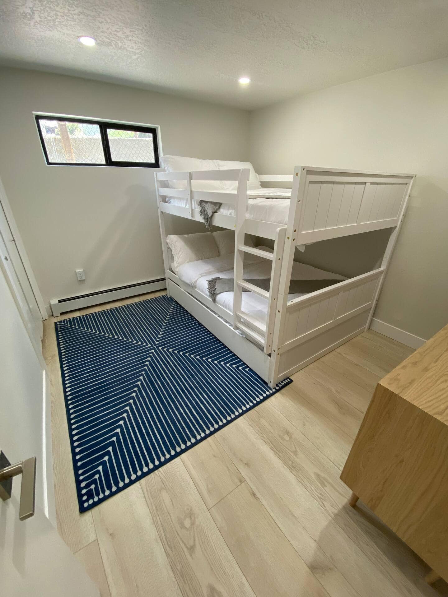 Remodeled condo bedroom in Park City featuring bunk beds and modern finishes.