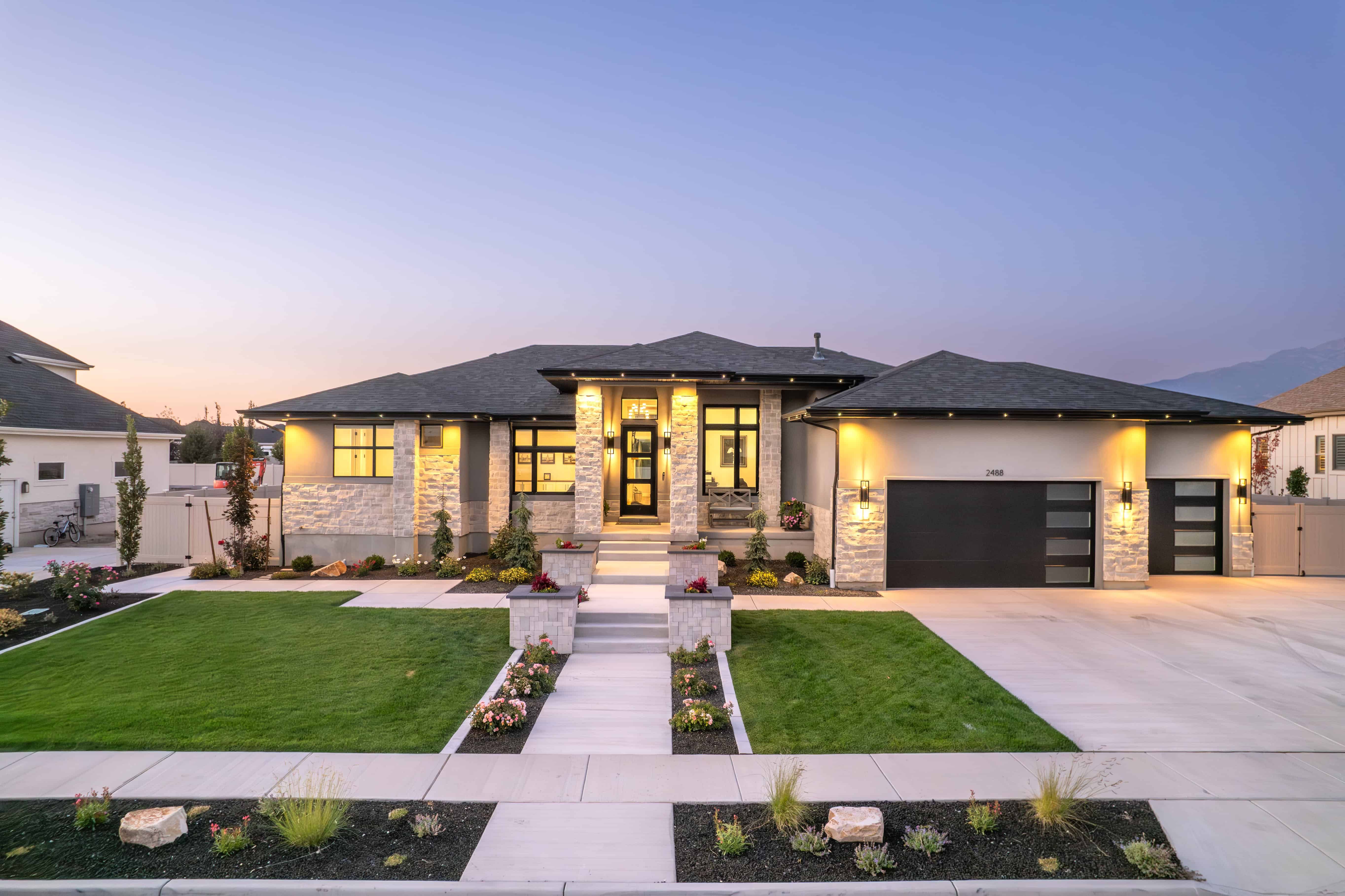 Raised paver garden boxes installed in a Lehi, Utah, backyard, offering a practical and attractive garden solution.