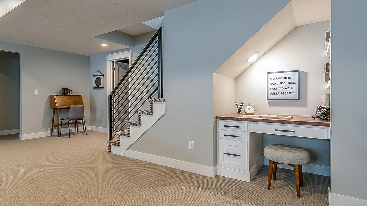 Spacious remodeled basement in Sandy, Utah, with modern finishes and ample lighting.