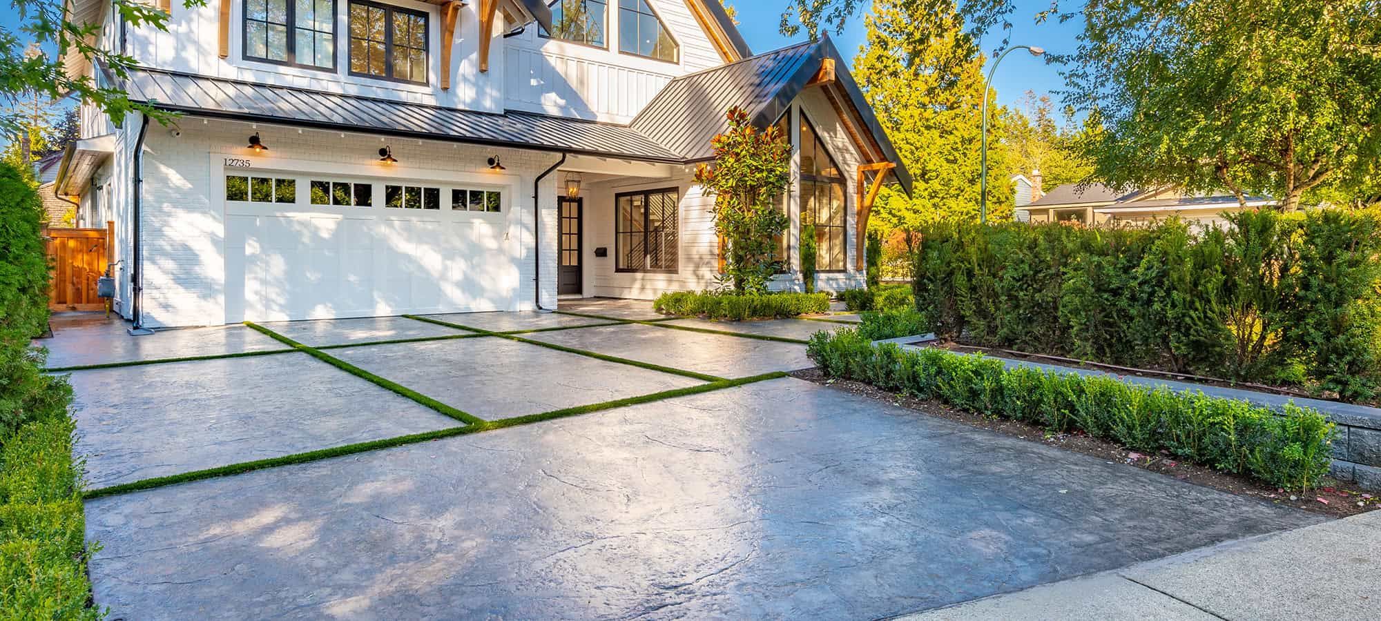 Stamped concrete driveway installation in Salt Lake City by Pitt Landscape and Construction