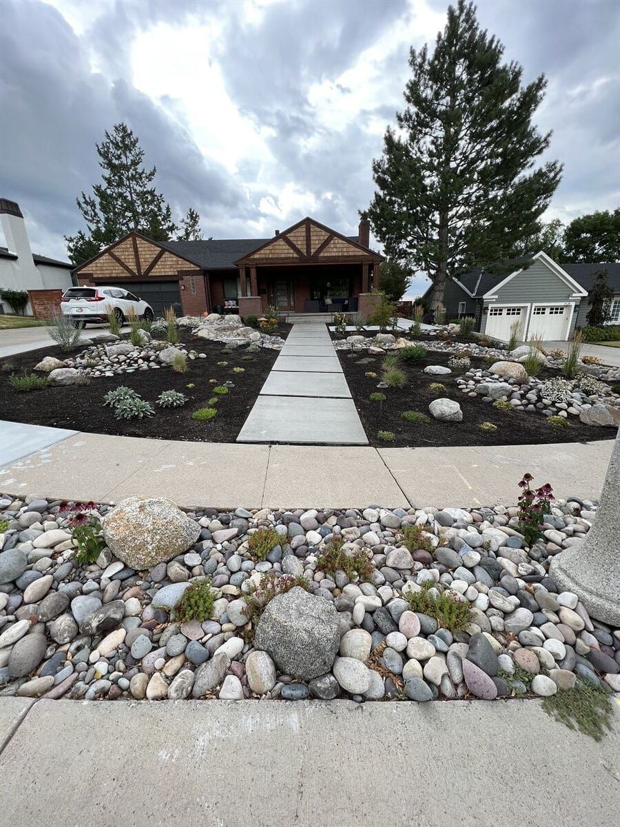 Xeriscaping design in Salt Lake City with gravel and mulch for sustainable landscaping.