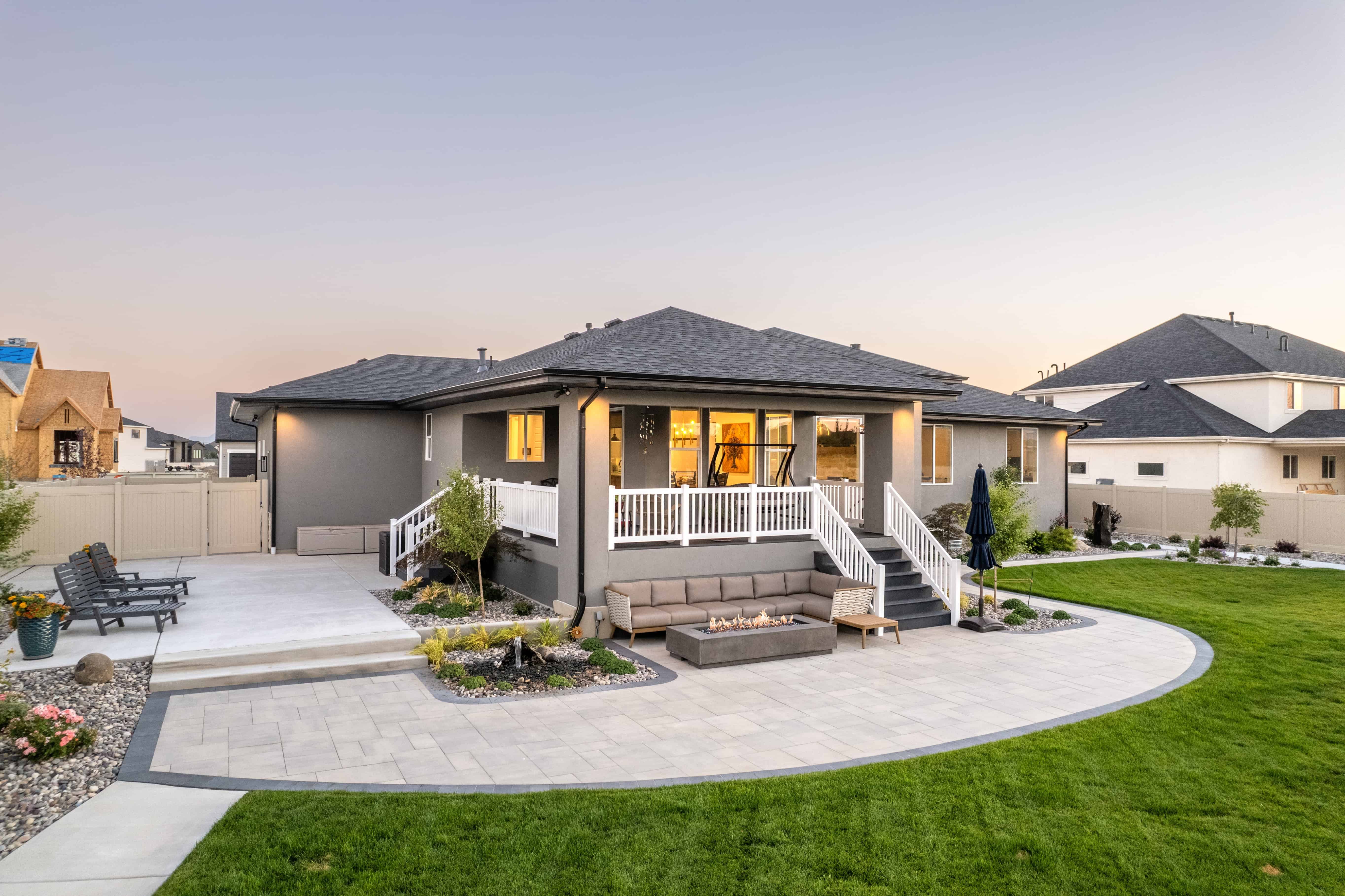 Custom backyard pavers patio installation in Lehi, Utah, featuring durable and stylish interlocking pavers.