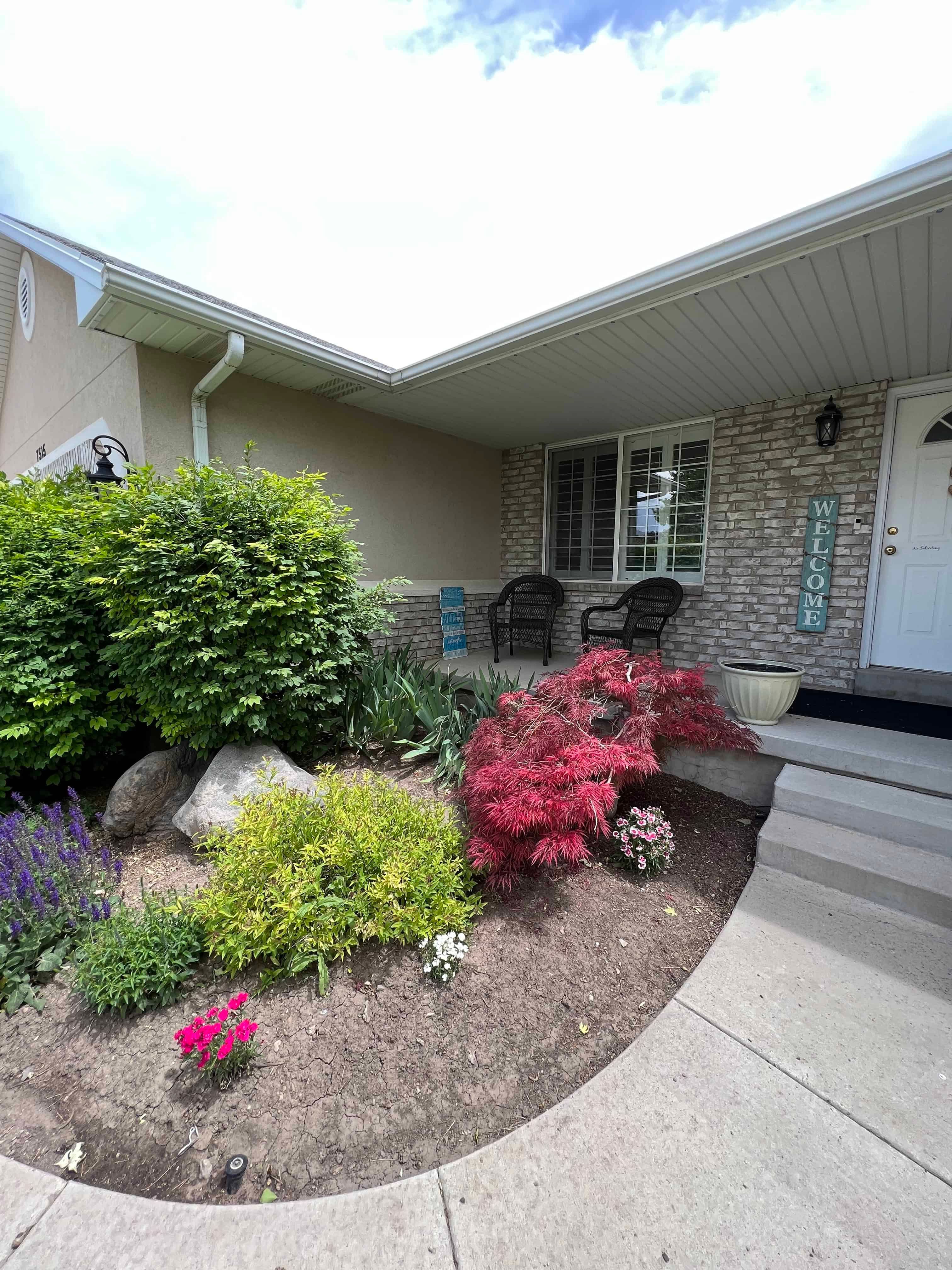 Before photo of front planter bed in West Jordan, Utah prior to landscape renovation.