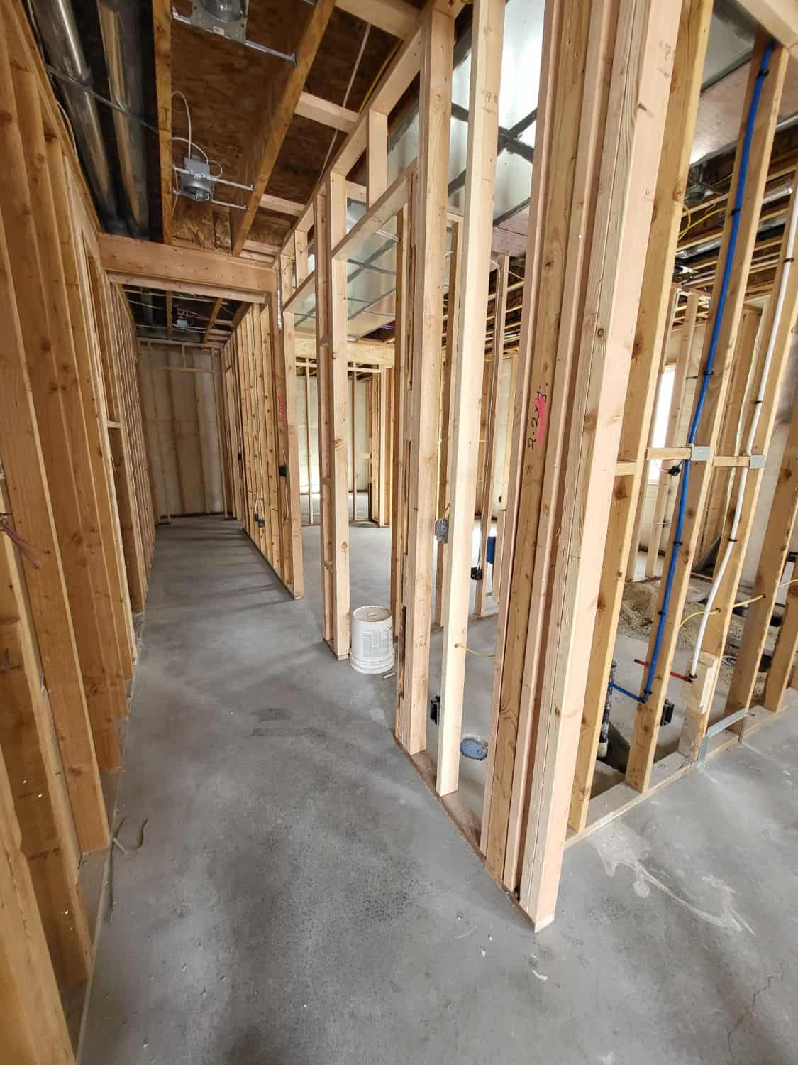 Framing in progress for a basement construction project, showcasing expert craftsmanship and attention to detail.