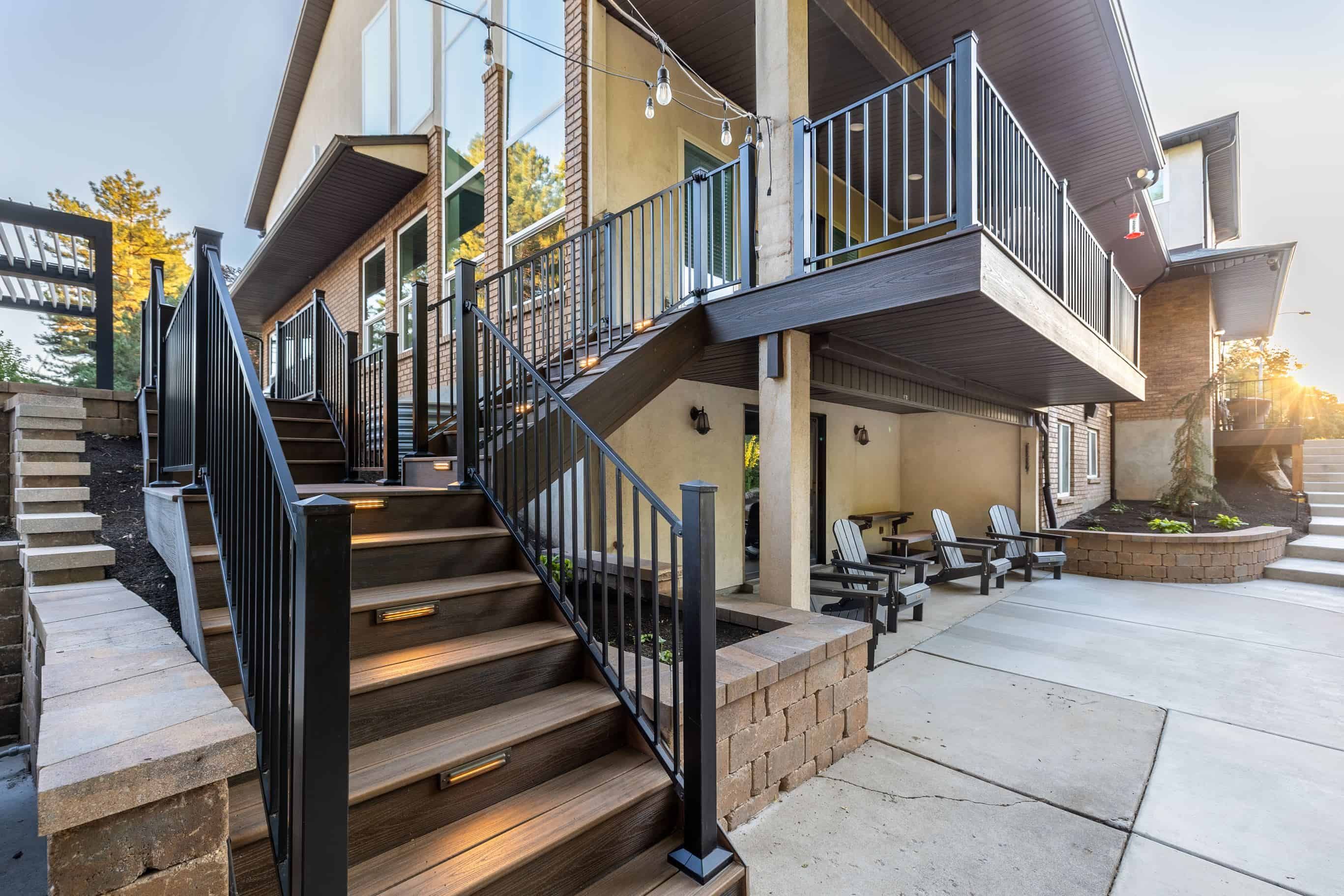 In this project, we designed and installed a spacious Trek composite deck with stairs leading to the backyard. The metal railing adds a sleek, modern touch, ensuring both safety and style for the homeowner in Murray.