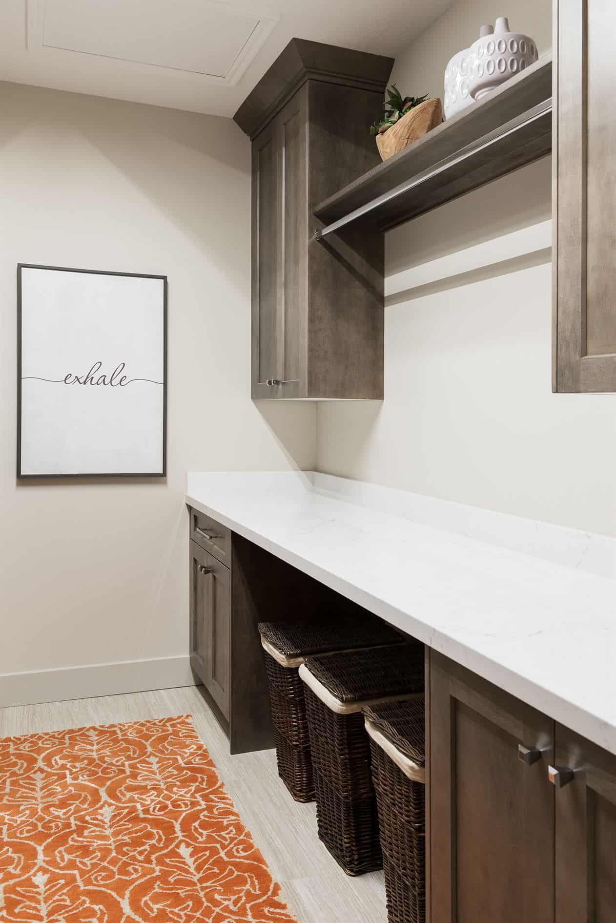Custom dark wood storage cabinetry with a white countertop and open shelving