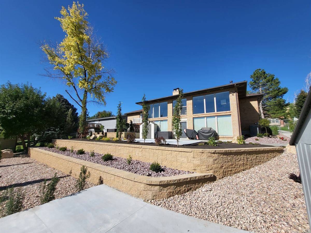 Landscape architecture with a boulder retaining wall in Sandy, Salt Lake City.