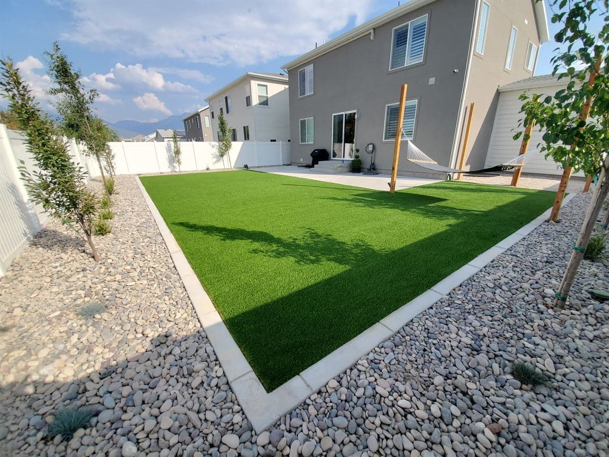 Custom landscape designs tailored to Utah properties with lush green garden