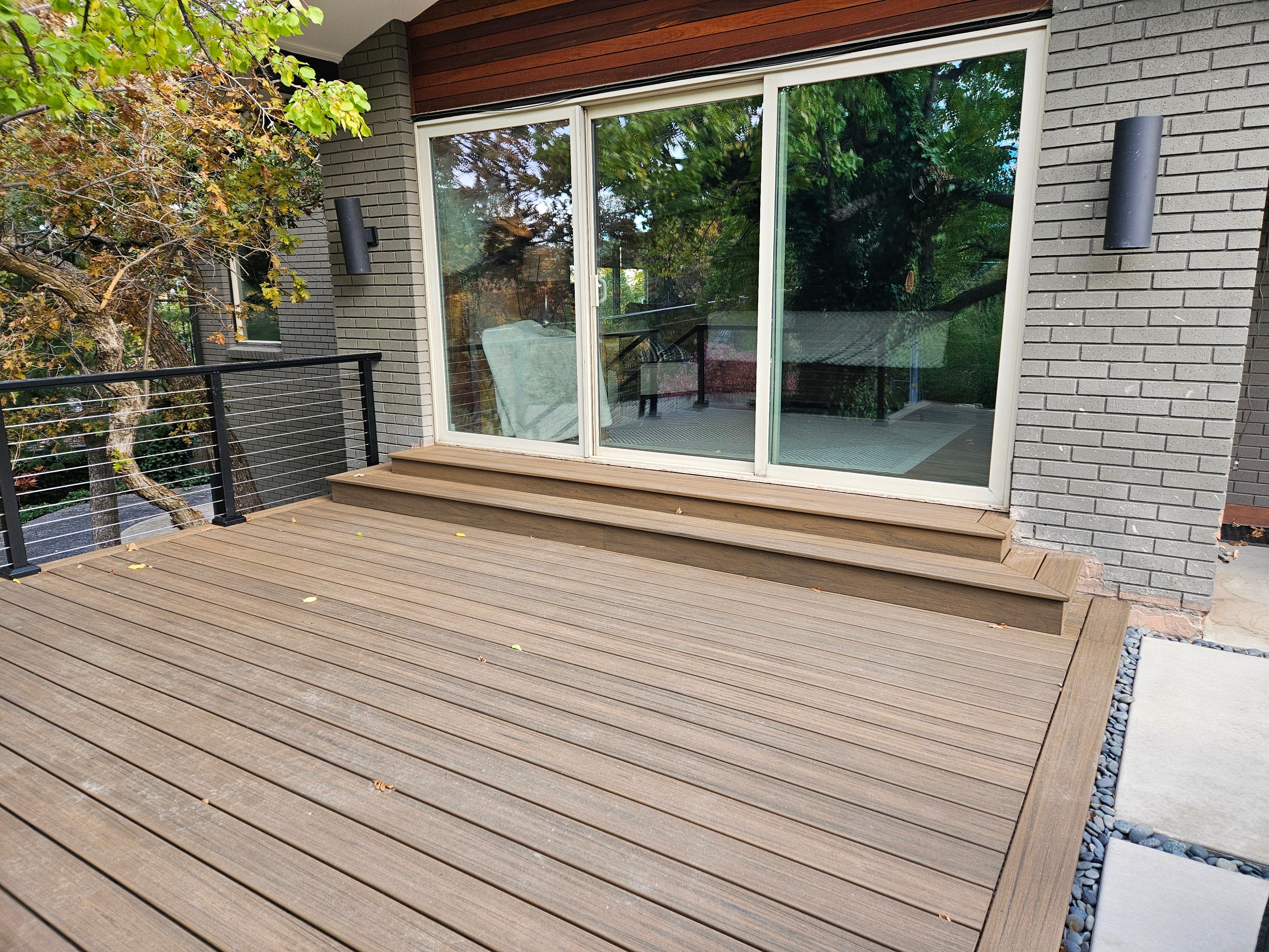 Backyard Trex deck overlooking landscaped yard in Holladay, Utah.