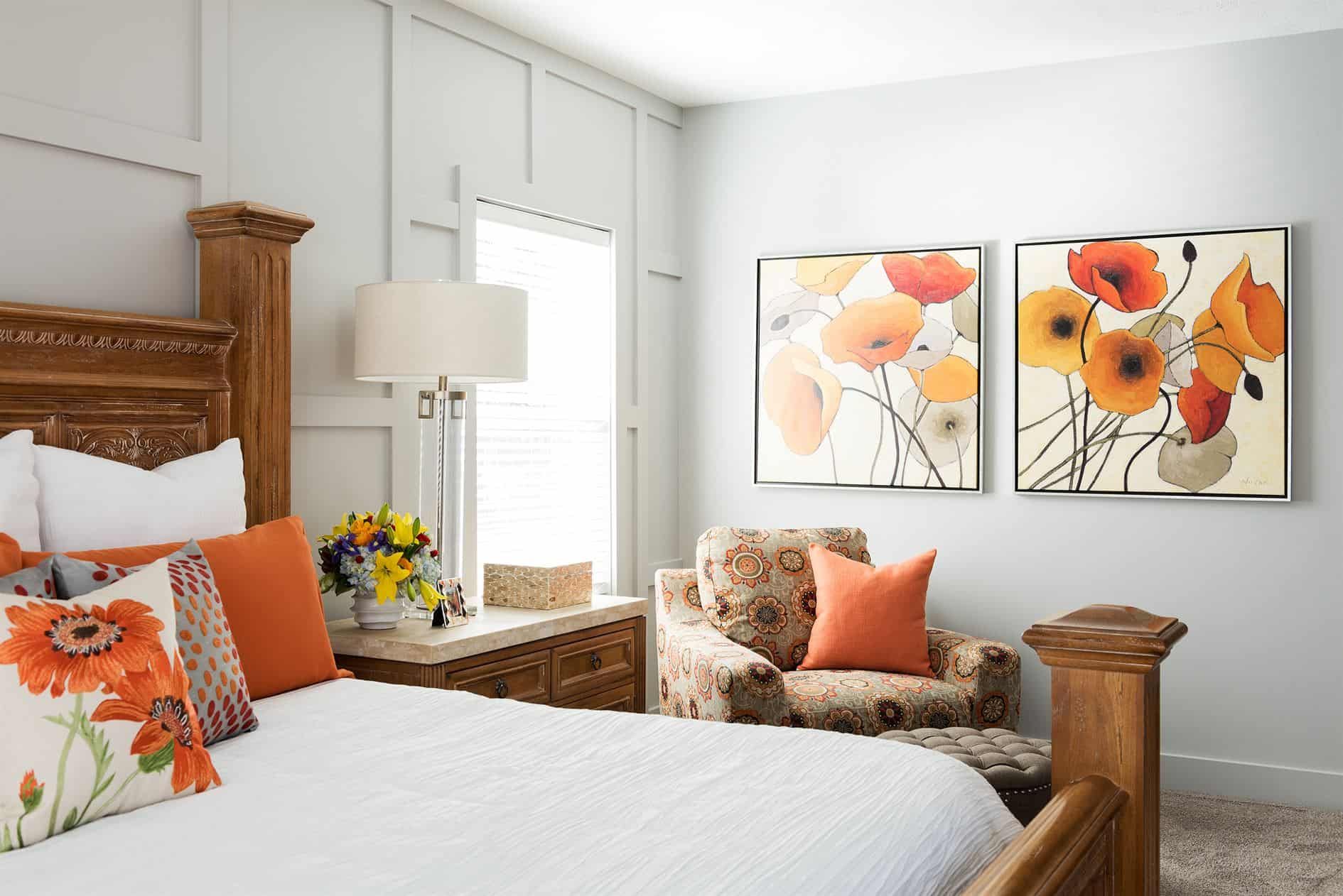 Finished primary bedroom remodel with decorative wall paneling and custom furnishings