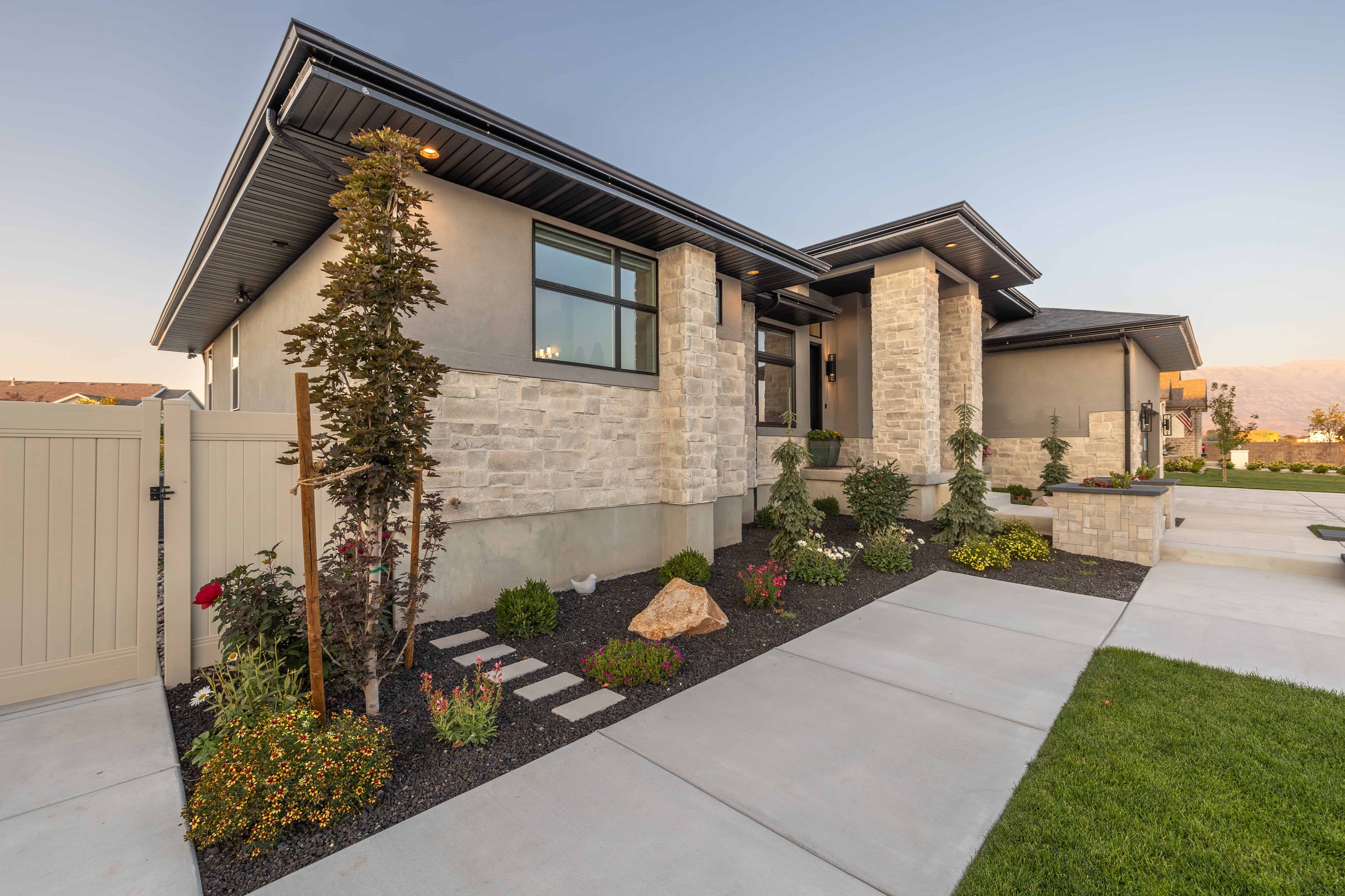 Front Yard Xeriscaping in Lehi with Dark Gravel & Concrete