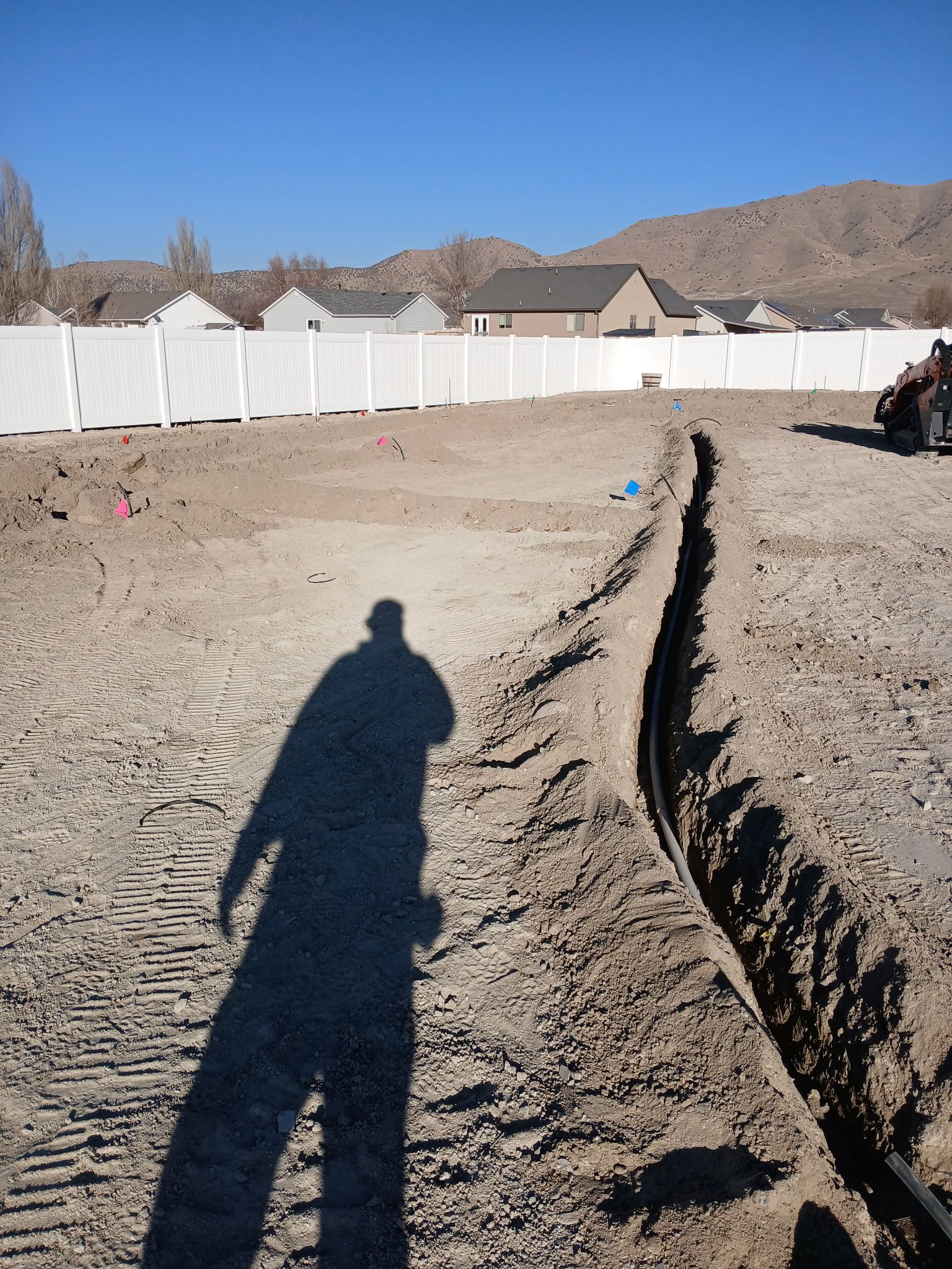 Main irrigation line trench during backyard landscape construction