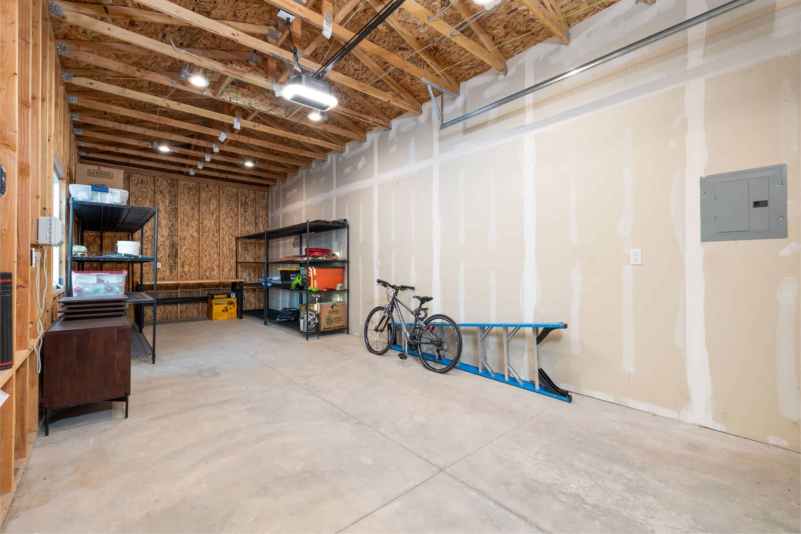 Interior framing and drywall work during detached garage construction