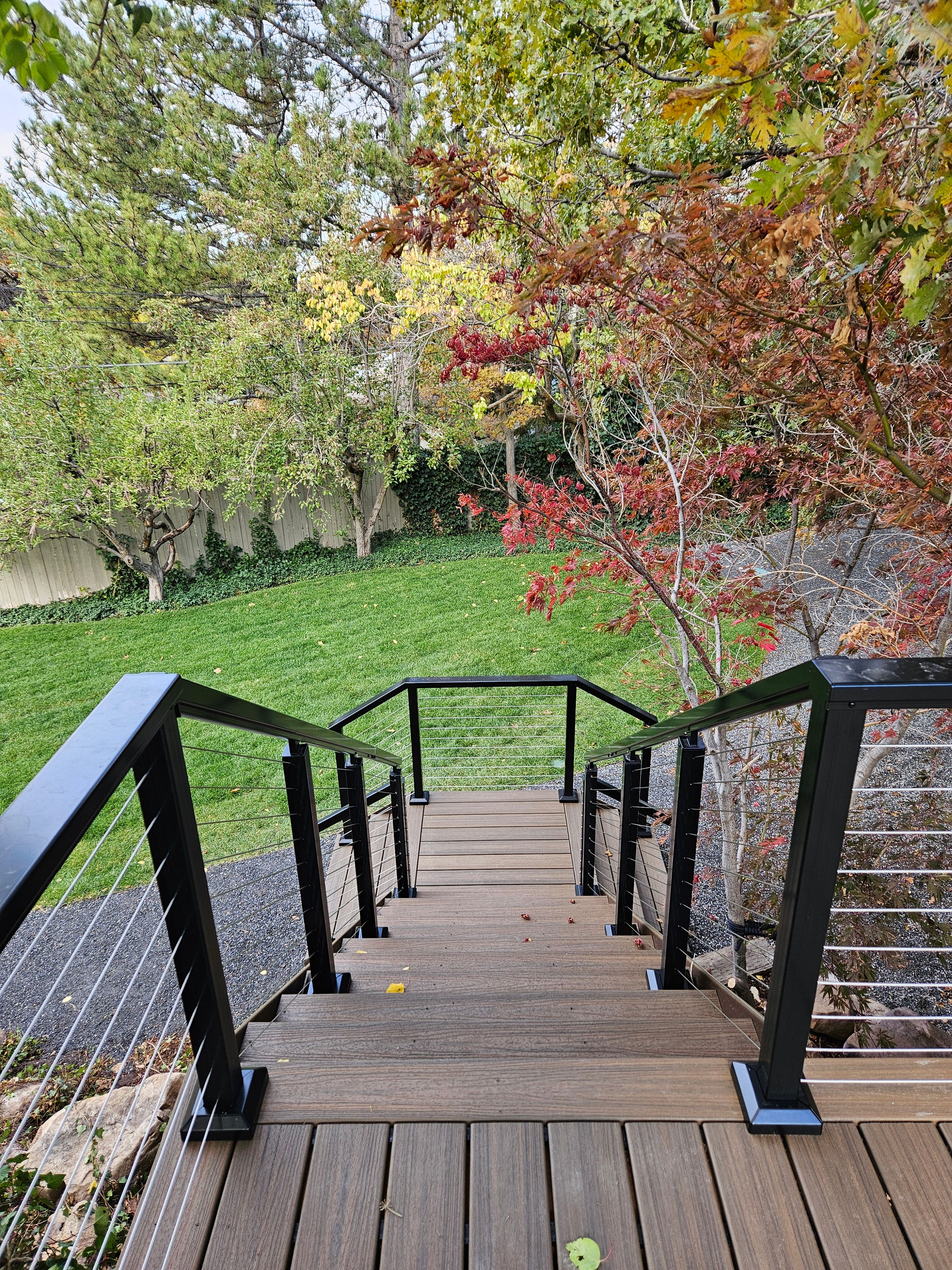 Trex composite steps leading to lower yard level in Holladay.