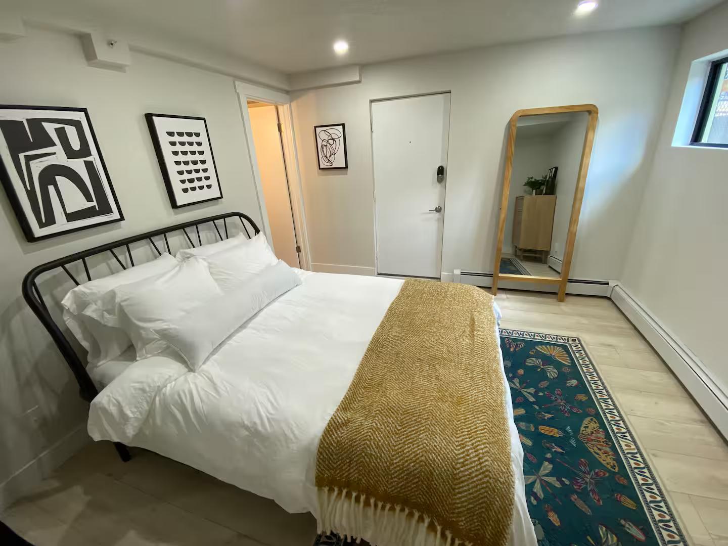 Finished master bedroom in Park City condo remodel staged for Airbnb.