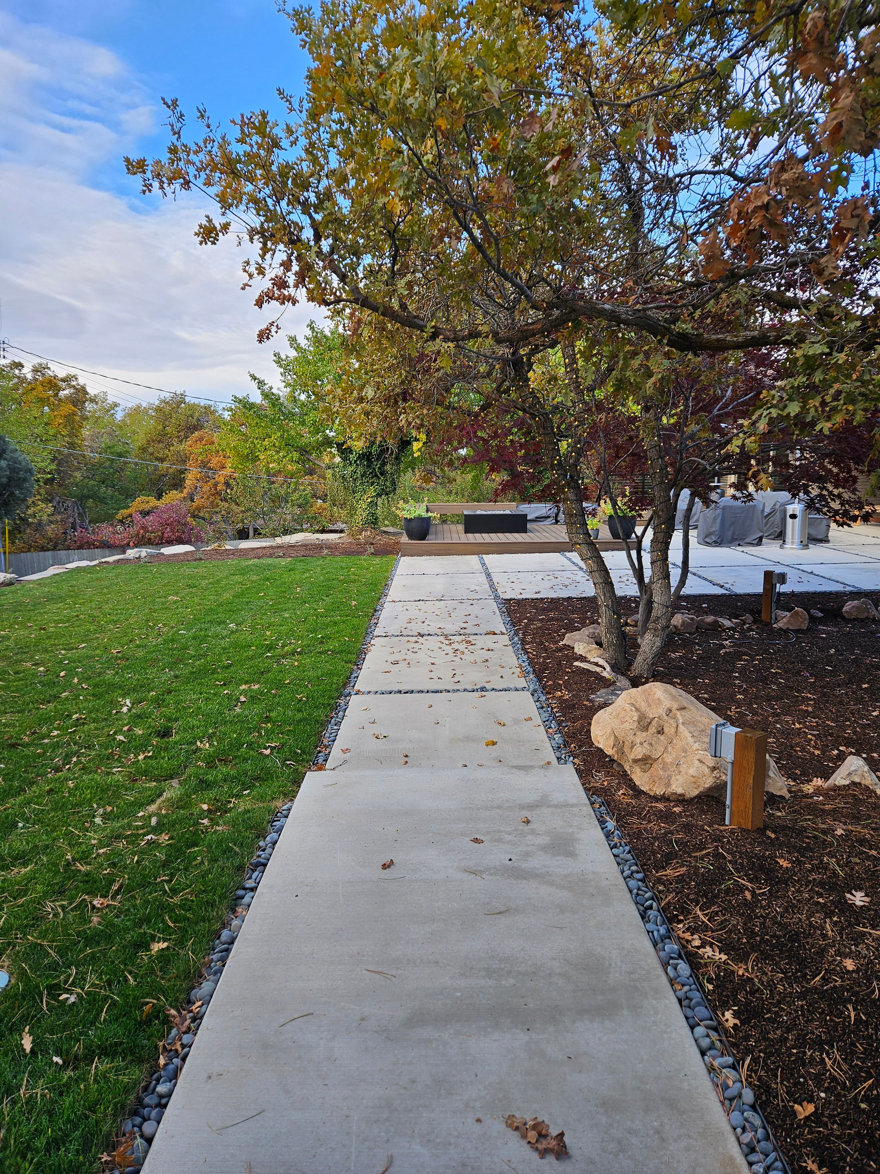 Modern concrete walkway installation in Holladay, Utah residential project.