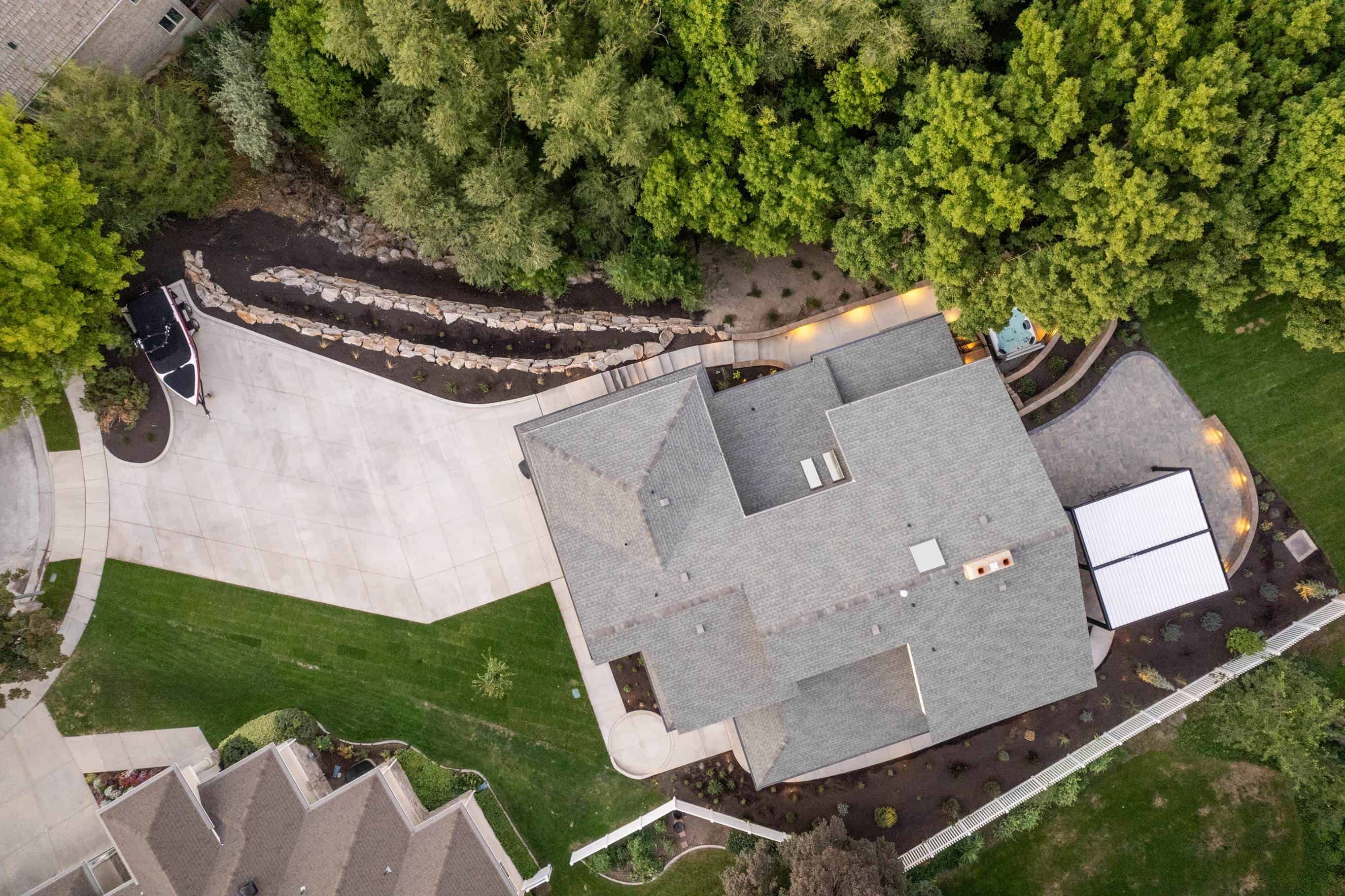 Aerial documentation view of a completed Murray property with a concrete driveway and backyard retaining wall.